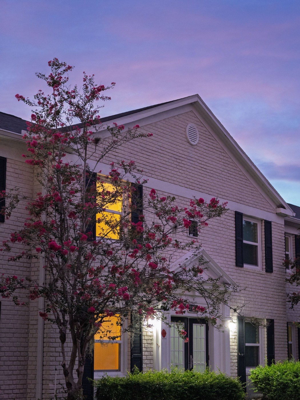 Finished home exterior lit up at dusk